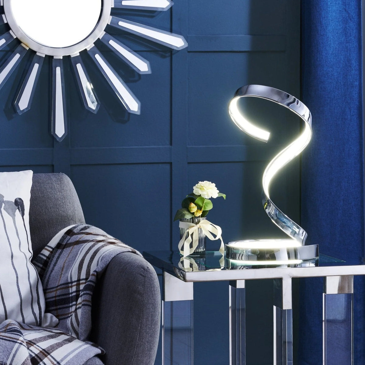 The Hamburg Chrome Table Lamp will look stunning on your living room table.